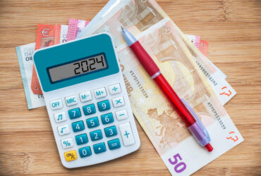 2024 numbers on a calculator and euros banknotes, new year finance, money, inflation and budget illustration