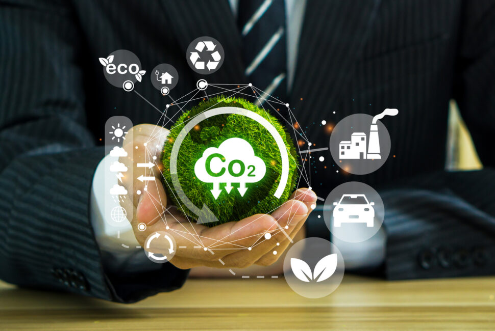 Reduce CO2 emission concept in the businessman hand with icons, global warming for environmental.Net zero and carbon neutral concept.